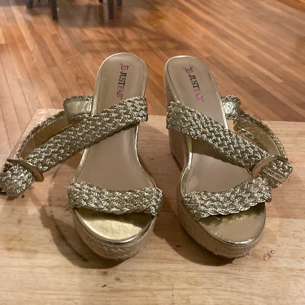 This shoe is a size 10 wedges, gold strap up in front